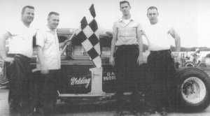 Winning modified and crew.  Pictured, left to right, Dave Wright, Dave Wright Jr., bob Burcham and his ace mechanic Bob Wright.