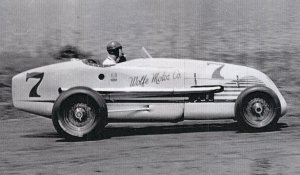 George Barringer piloting the Ervin Wolfe Special at Lakewood, Sept. of 1946.  This is the last known photo of Barringer, probably taken during time trials.  Note Barringer taking a drag off a cigarette as he rounds turn four.  Photo courtesy Bill Barringer