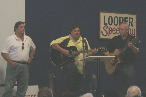Jay Sellers, Jeff Gilder and Perry Allen Wood perform their song "Back Roads and Moonshine" during the ceremony.  The song was written in honor of Mr. Parks.  You can learn more about it by going to www.racersreunion.com.