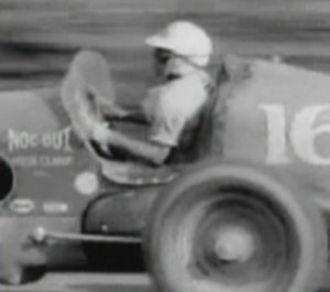 A close up look at Robson piloting the Noc-Out Hose Clamps Special during the Labor Day event at Lakewood from the newsreel footage.