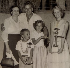 Jack Smith receives victory congratulations in the early fifties from his mother, Montare, his sister Edna and children Jackie and Gloria.  Photo courtesy the Weyman Milam family