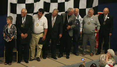 The 2009 inductees stand for the unveiling of the Hall of Fame display panel.
