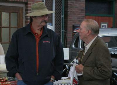 Moonshine festival grand Marshall Jim Mitchum (left), son of the late actor Robert Mitchum and GRHOF member Charlie Mincey (right) talk prior to the banquet.  Mitchum and Mincey worked together on a film called “Moonrunners”, which was filmed in Georgia in the mid ‘70s.  The film would become the basis for the television show “The Dukes of Hazzard”.