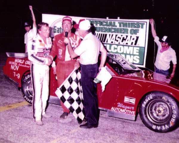 Sanders, pictured center, is congratulated by Dick Trickle after winning the first leg of the Triple Crown at Orlando.  Photos courtesy Ronnie Sanders