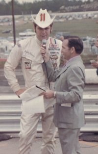 Mosteller interviews NASCAR star Buddy Baker at Atlanta International Raceway in the early '70s.